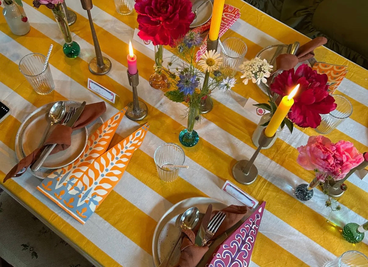 Yellow and white stripe tablecloth