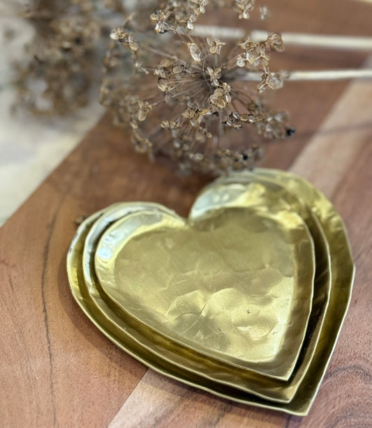 Set of three brass heart dishes