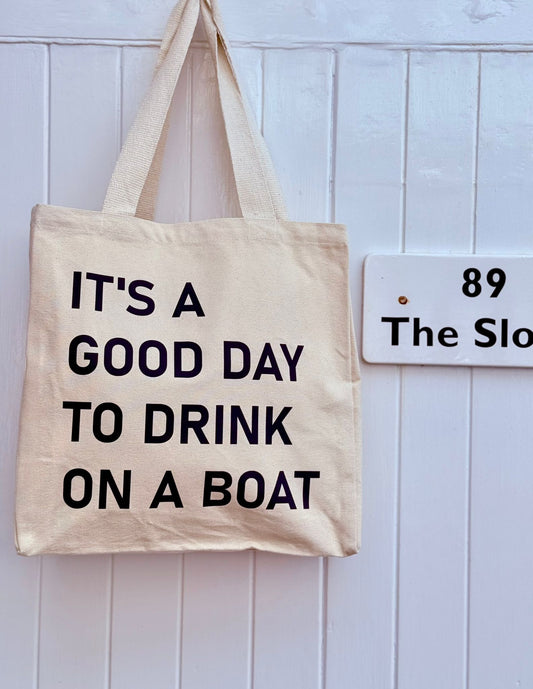 It’s a good day to drink on a boat canvas tote bag natural with navy text