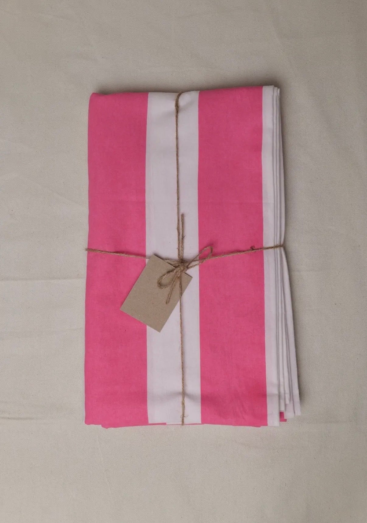 Pink and white striped tablecloth