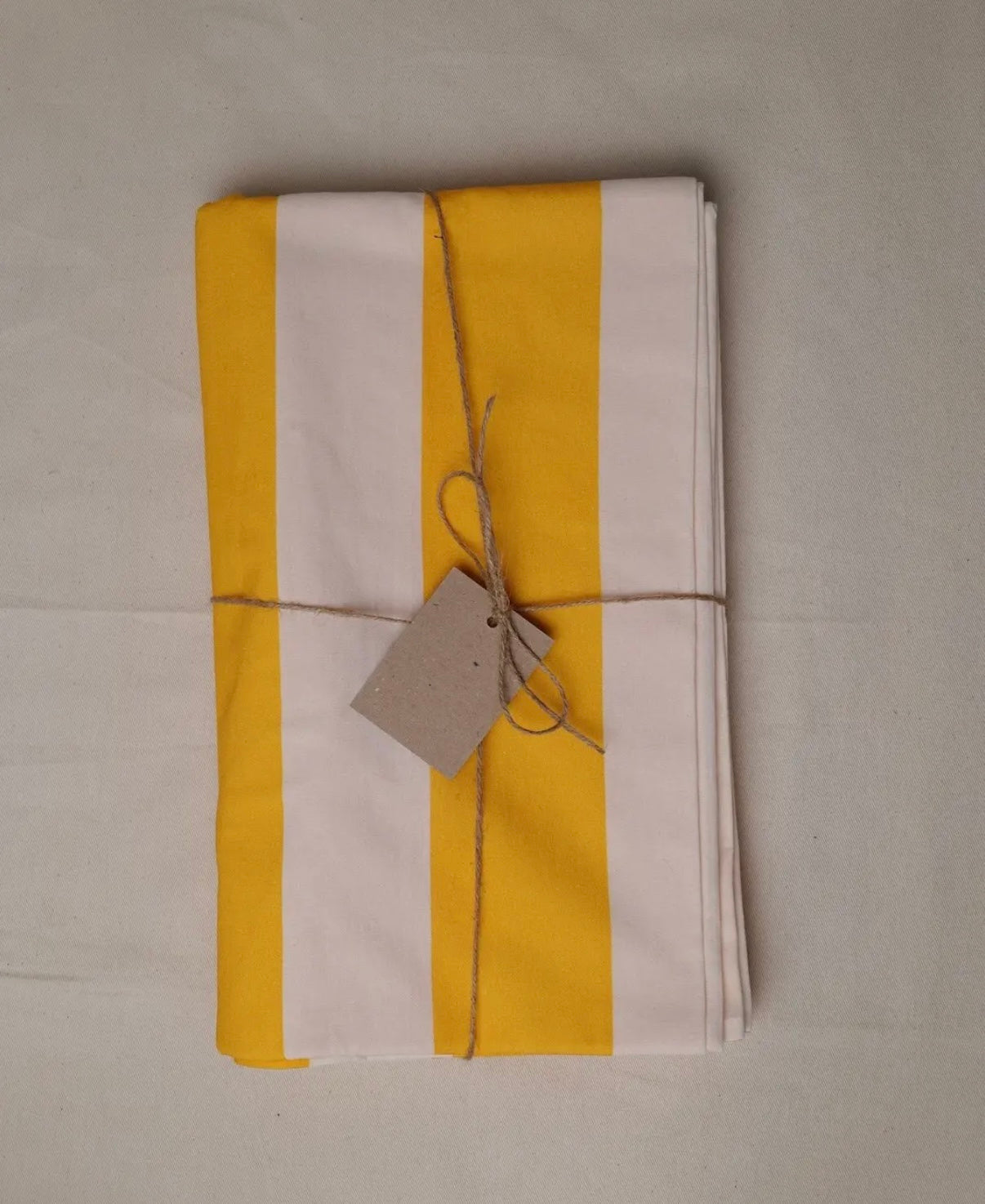 Yellow and white stripe tablecloth
