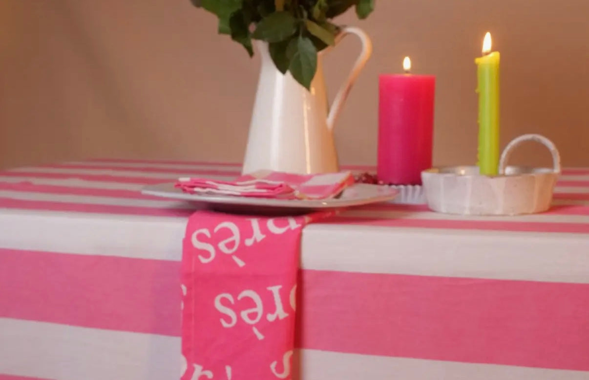 Pink and white striped tablecloth