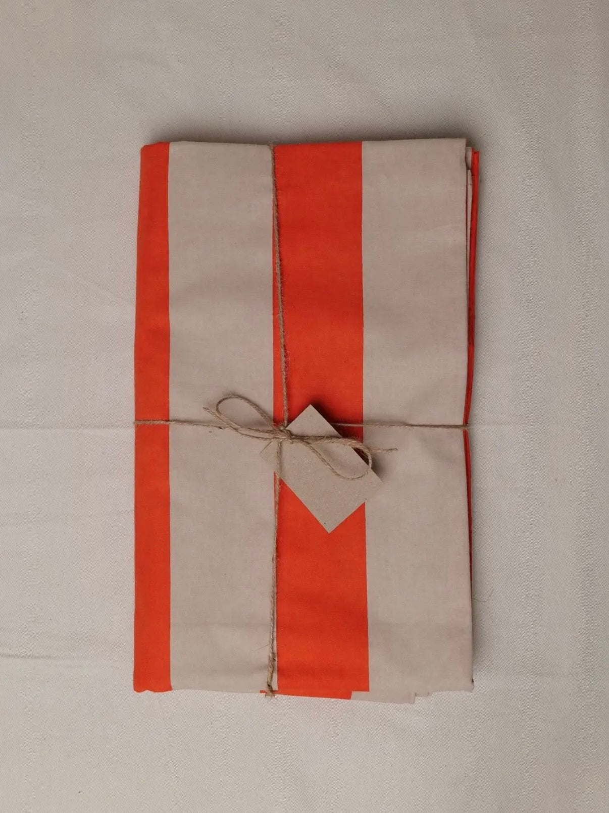 Orange and taupe striped tablecloth