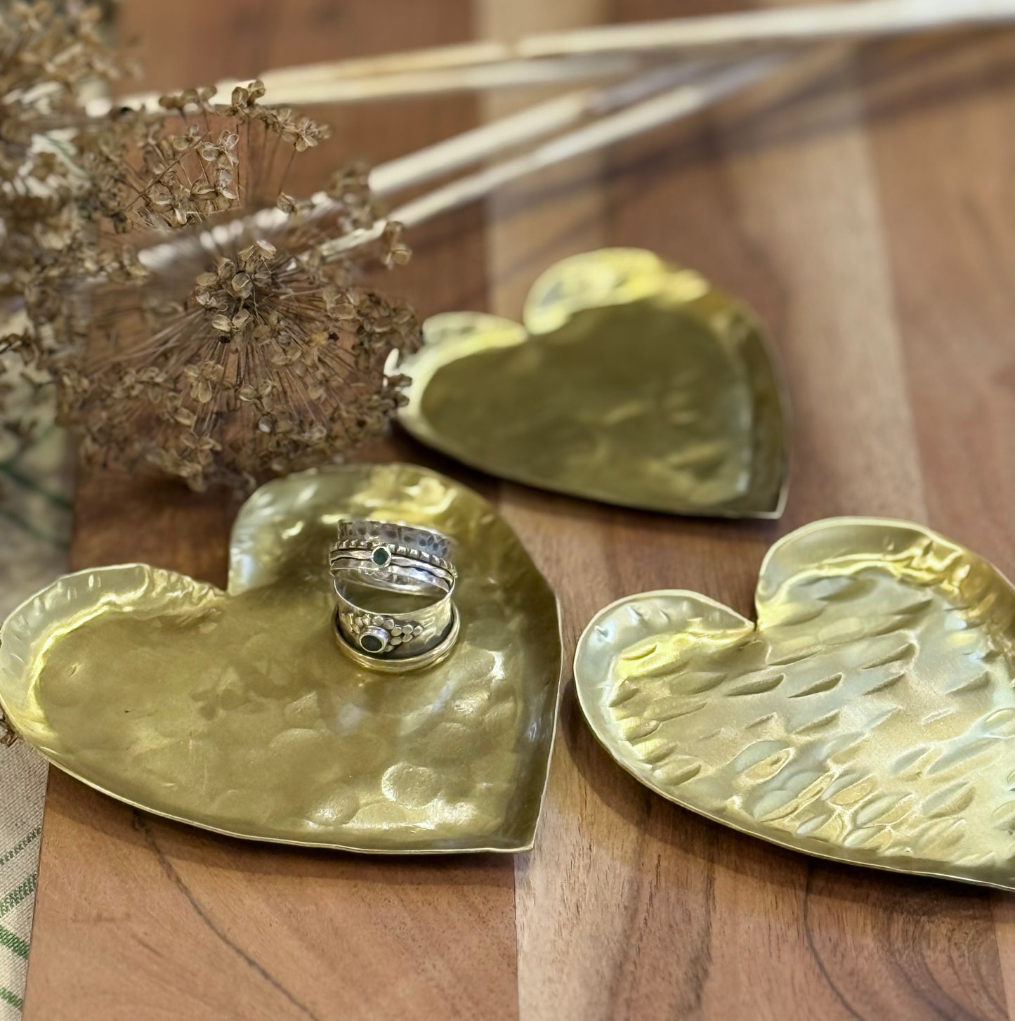 Set of three brass heart dishes
